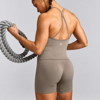 EnhanceLift™ Seamless Strappy Racer Tank Top with Built in Bra Shelf with Gray Logo | Warm Minky