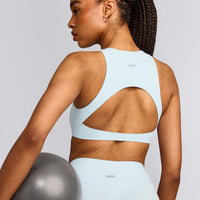 SoftMotion™ High Neck Sports Bra with Grey Logo |  Cloud Blue