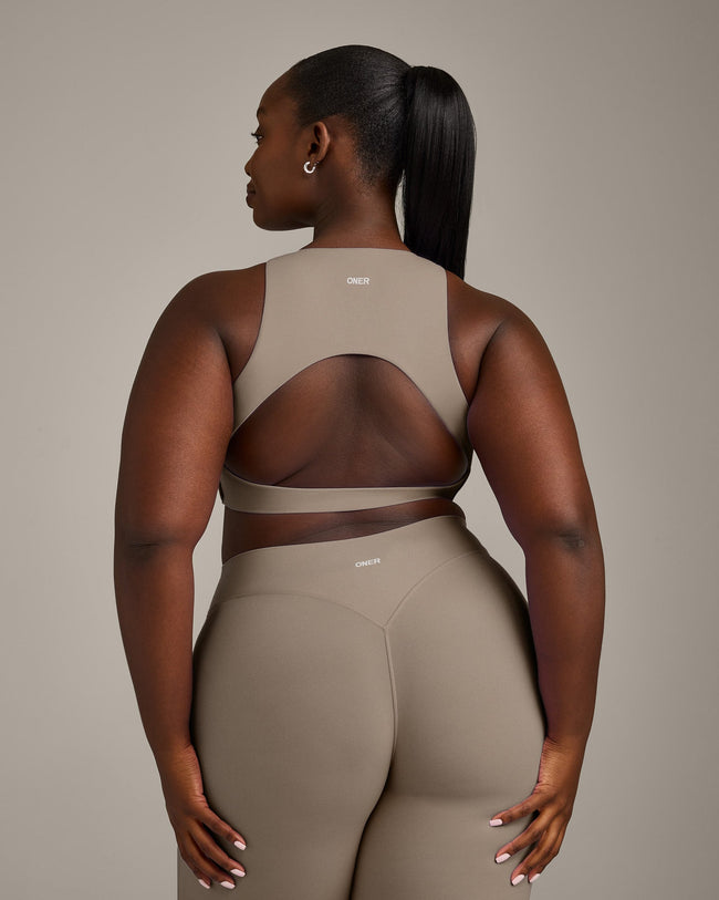 SoftMotion™ High Neck Sports Bra with Grey Logo | Minky