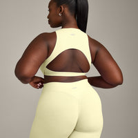 SoftMotion™ High Neck Sports Bra with Grey Logo | Pastel Yellow