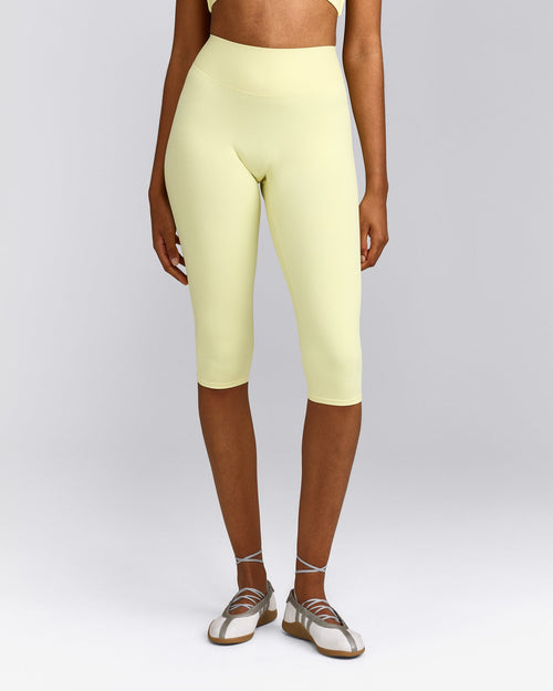 SoftMotion™ High Waisted Capri Leggings with Gray Logo | Pastel Yellow