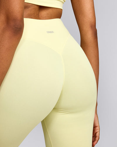 SoftMotion™ High Waisted Capri Leggings with Gray Logo | Pastel Yellow