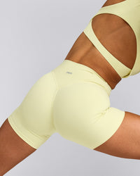 SoftMotion™ High Waisted Shorts 6" with Grey Logo | Pastel Yellow