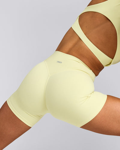 SoftMotion™ High Waisted Shorts 6" with Grey Logo | Pastel Yellow