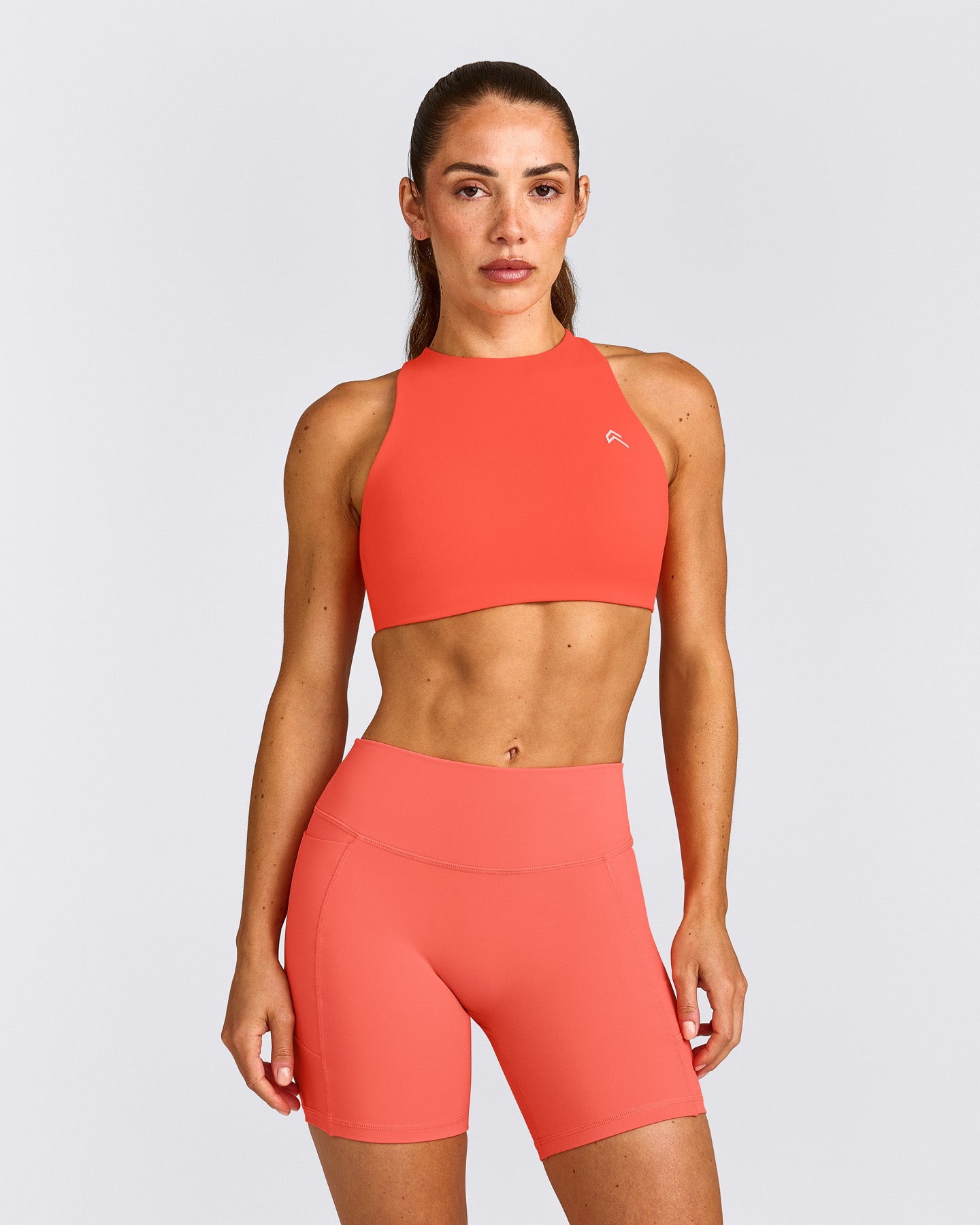 EasyLift™ High Neck Sports Bra with Grey Logo | Hyper Orange