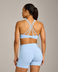 EasyLift™ High Neck Sports Bra with Grey Logo | Powdered Blue