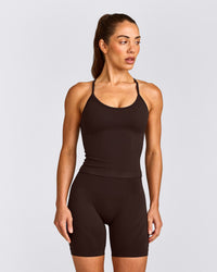 EnhanceLift™ Seamless Strappy Racer Tank Top with Built in Bra Shelf with Gray Logo | 70% Cocoa
