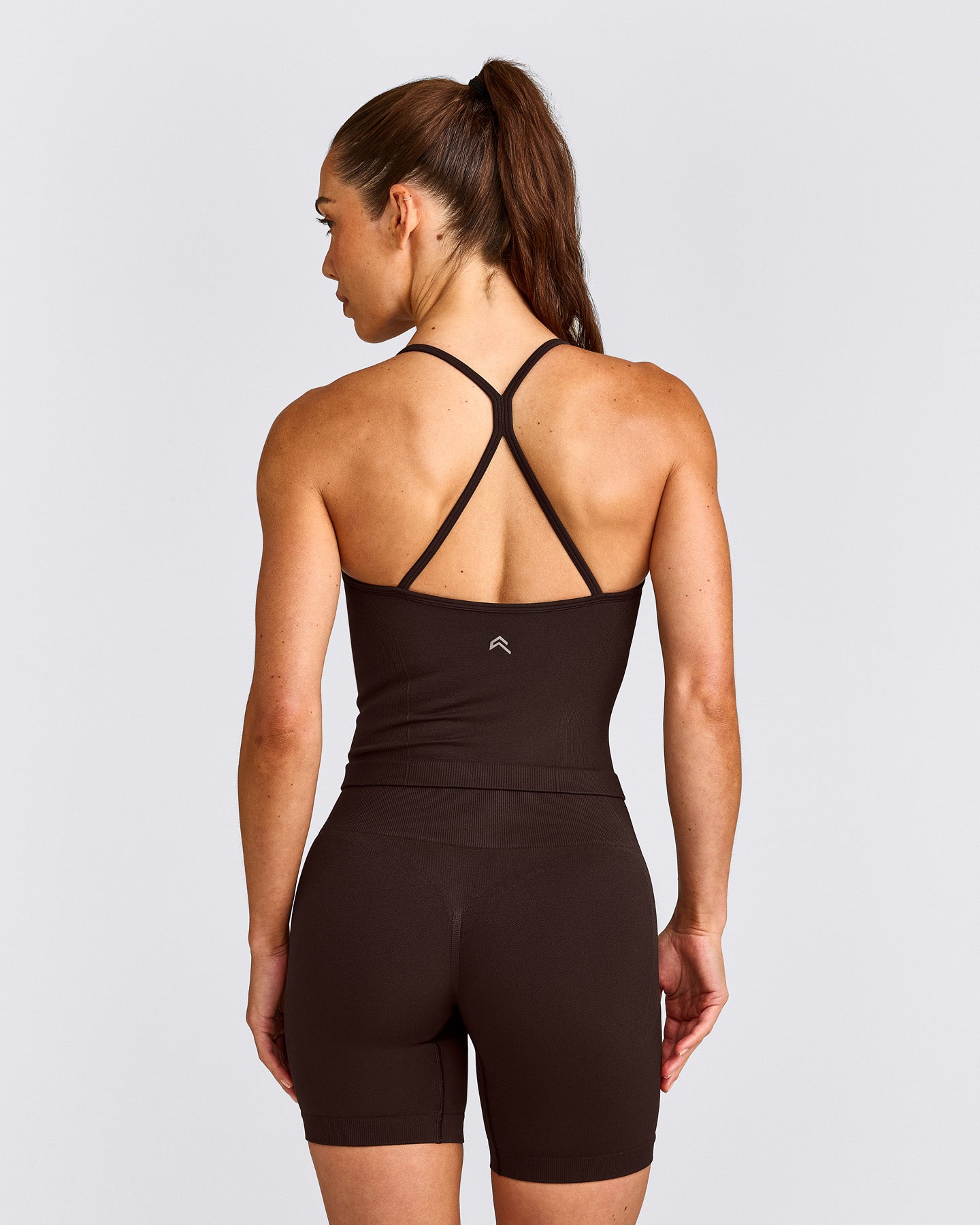 EnhanceLift™ Seamless Strappy Racer Tank Top with Built in Bra Shelf with Gray Logo | 70% Cocoa
