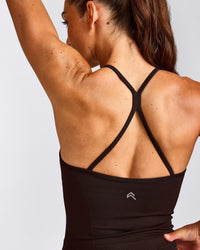 EnhanceLift™ Seamless Strappy Racer Tank Top with Built in Bra Shelf with Gray Logo | 70% Cocoa