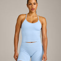 EnhanceLift™ Seamless Strappy Racer Vest with Built in Bra Shelf with Grey Logo | Powdered Blue
