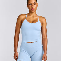 EnhanceLift™ Seamless Strappy Racer Tank Top with Built in Bra Shelf with Gray Logo | Powdered Blue