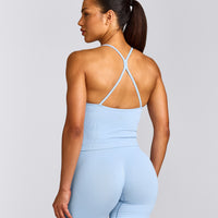 EnhanceLift™ Seamless Strappy Racer Tank Top with Built in Bra Shelf with Gray Logo | Powdered Blue