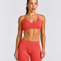 EnhanceLift™ Seamless Strappy Sports Bra with Gray Logo | Dark Charged Coral