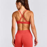EnhanceLift™ Seamless Strappy Sports Bra with Gray Logo | Dark Charged Coral