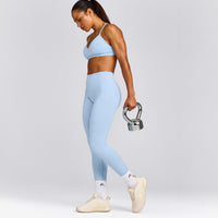 EnhanceLift™ Seamless Strappy Sports Bra with Gray Logo | Powdered Blue