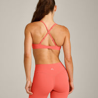 UnifiedMove™ Cross Back Sports Bra with Reflective Logo | Light Charged Coral