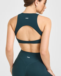 SoftMotion™ High Neck Sports Bra with White Logo | Oil Blue