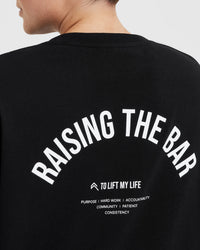 Raising The Bar Graphic Unisex T-Shirt | Black